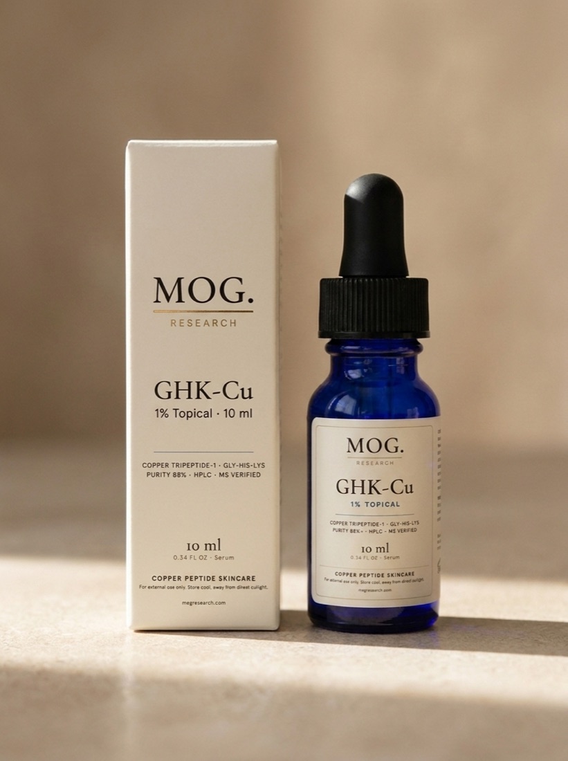MOG Glow Peptide Serum bottle beside its apothecary-style carton packaging